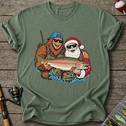 Bigfoot and Santa Holding Rainbow Trout Christmas Fishing Graphic T-Shirt
