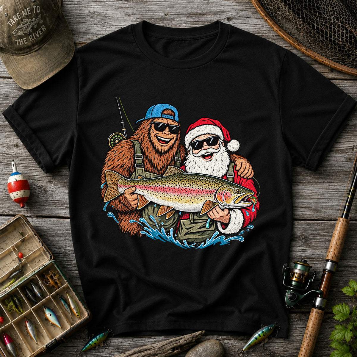 Bigfoot and Santa Holding Rainbow Trout Christmas Fishing Graphic T-Shirt