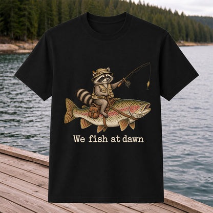 We Fish at Dawn Raccoon Riding a Rainbow Trout Fishing T-Shirt
