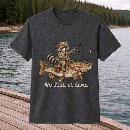 We Fish at Dawn Raccoon Riding a Rainbow Trout Fishing T-Shirt