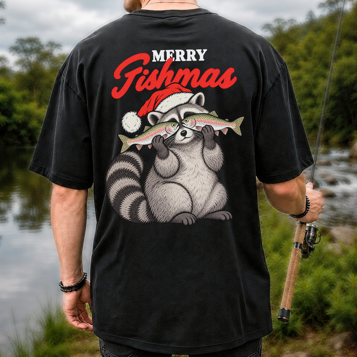 Santa Raccoon Holding Fish Christmas Fishing Graphic T-Shirt | Back Print