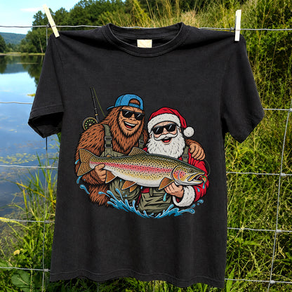 Bigfoot and Santa Holding Rainbow Trout Christmas Fishing Graphic T-Shirt