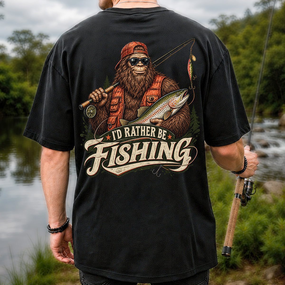 Bigfoot Holding Trout Funny Fishing Graphic T-Shirt | Back Print