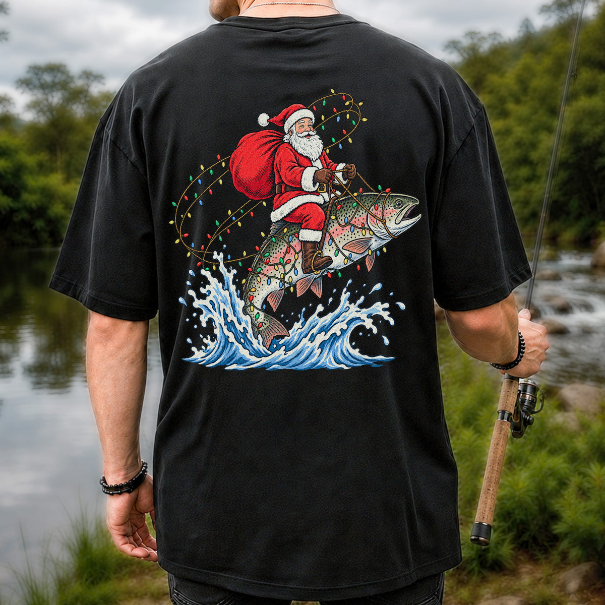 Santa Riding a Christmas-Lighted Rainbow Trout Fishing Graphic T-Shirt | Back Print