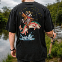 Cowboy Raccoon Riding a Rainbow Trout Fishing Graphic T-Shirt | Back Print