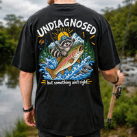 Undiagnosed But Something Ain't Right Raccoon Trout Fishing T-Shirt | Back Print