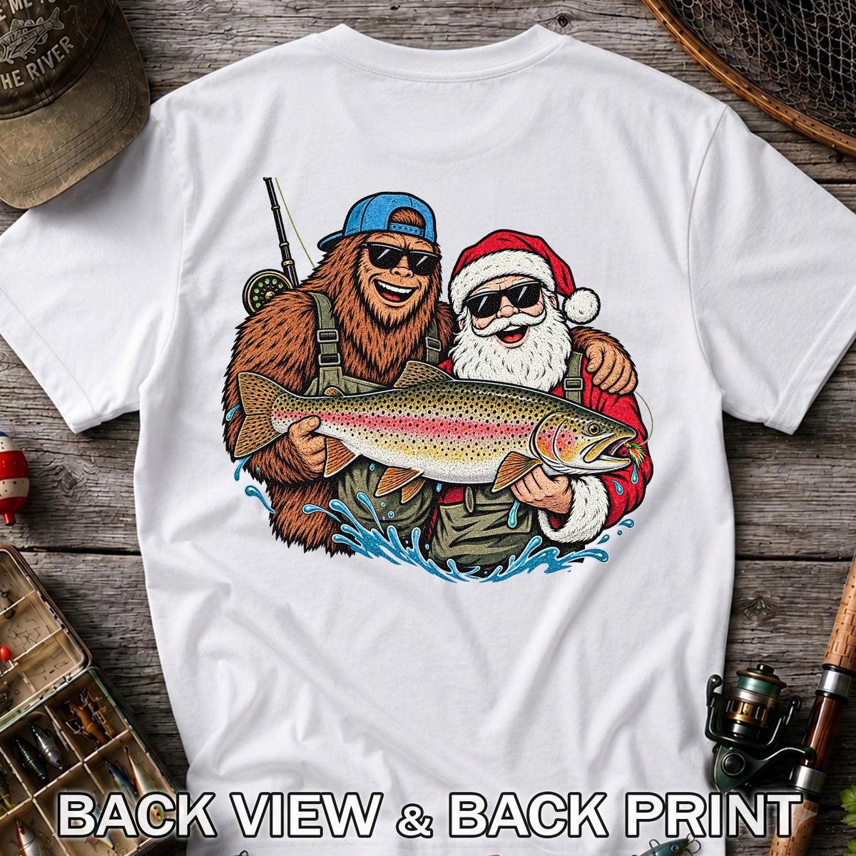 Bigfoot and Santa Holding Rainbow Trout Christmas Fishing Graphic T-Shirt | Back Print