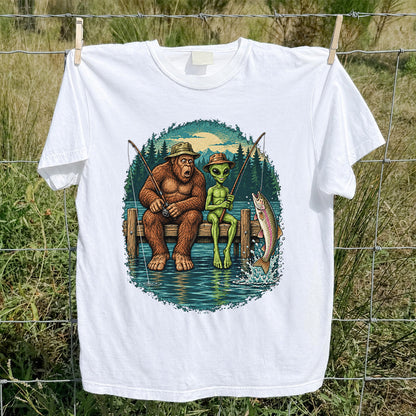 Bigfoot and Alien Fishing on a Dock with Rainbow Trout Graphic T-Shirt