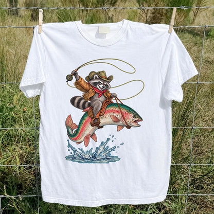 Cowboy Raccoon Riding a Rainbow Trout Fishing Graphic T-Shirt