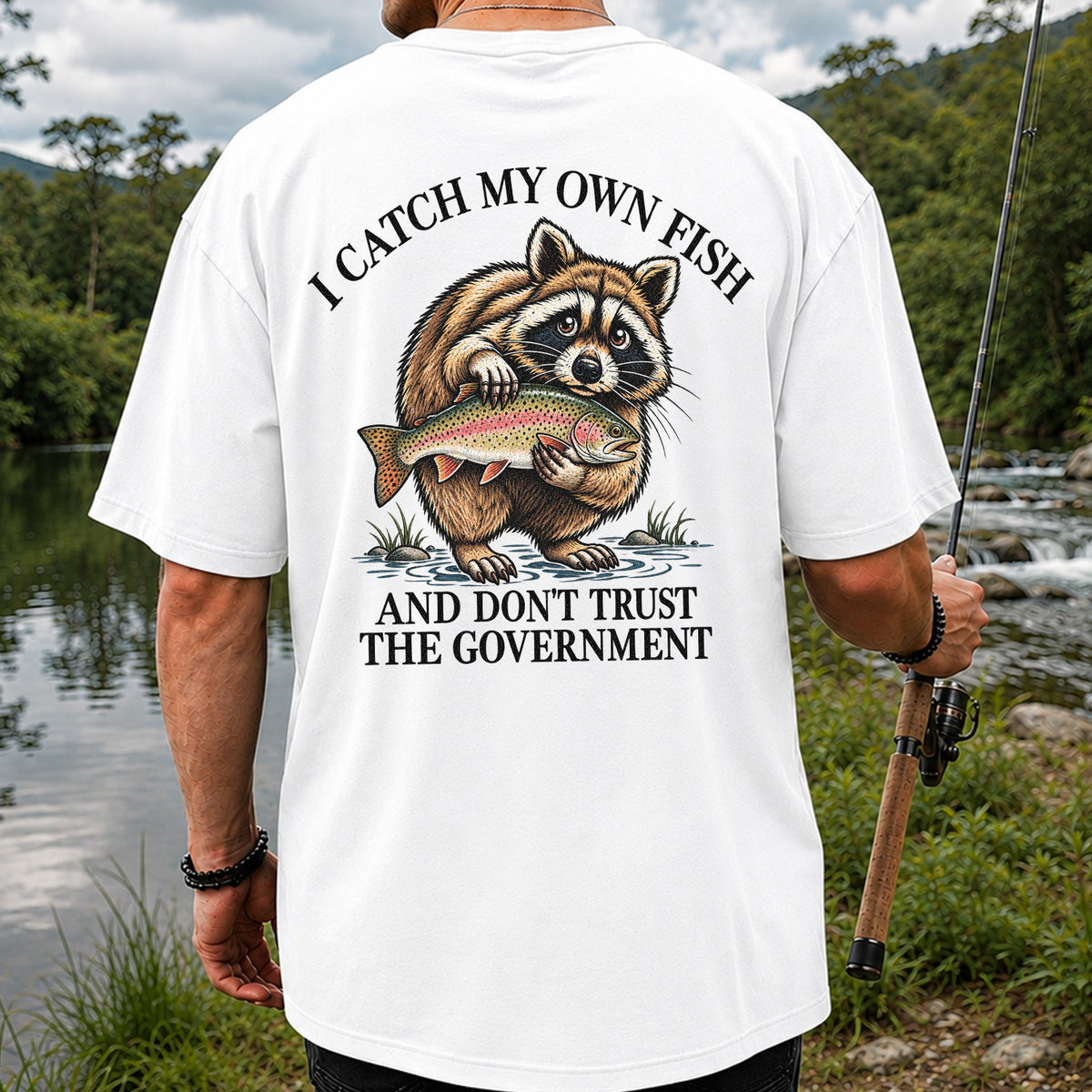Raccoon Holding Rainbow Trout Fishing Graphic T-Shirt | Back Print
