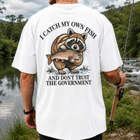 Raccoon Holding Rainbow Trout Fishing Graphic T-Shirt | Back Print