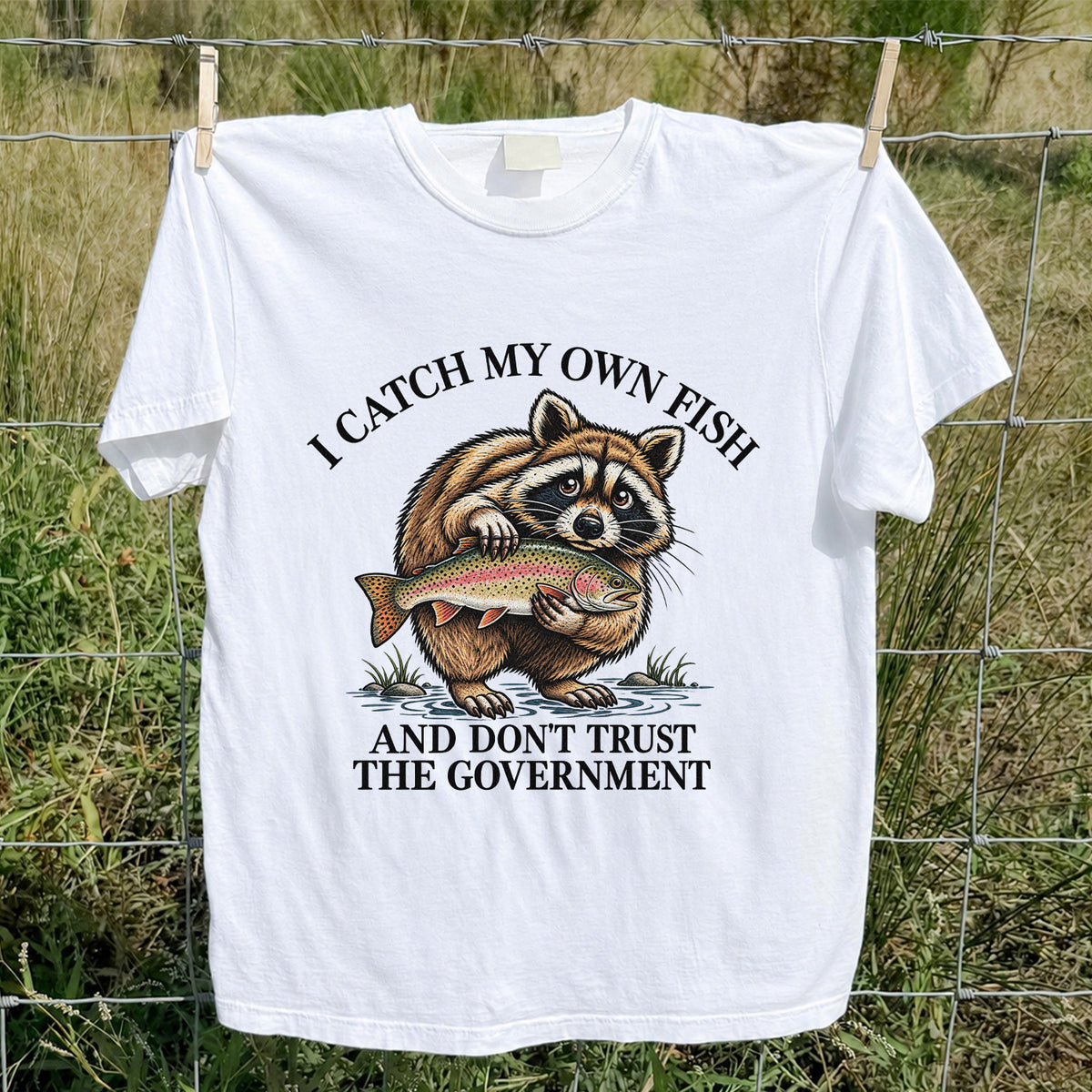 Raccoon Holding Rainbow Trout Fishing Graphic T-Shirt